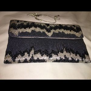 Rock n Roll inspired sequined envelope purse.